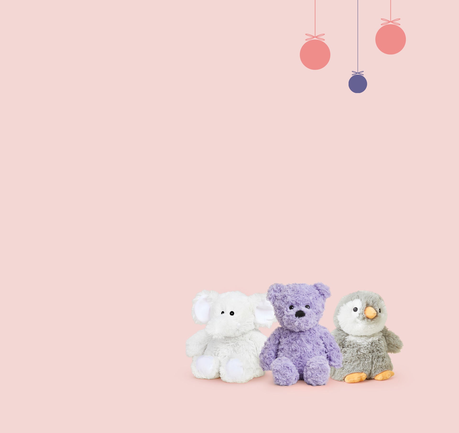 Various Warmies stuffed animals with a Holiday themed background