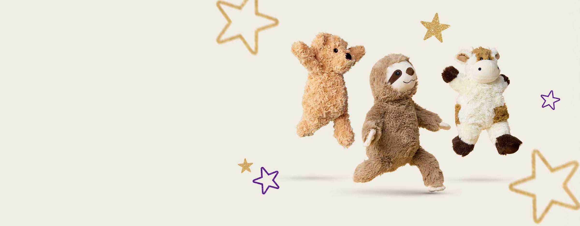 Various Warmies Stuffed Animals jumping around gold and purple stars